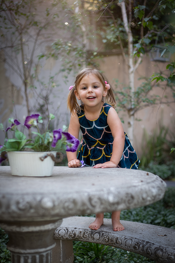 girl standing on table in forest